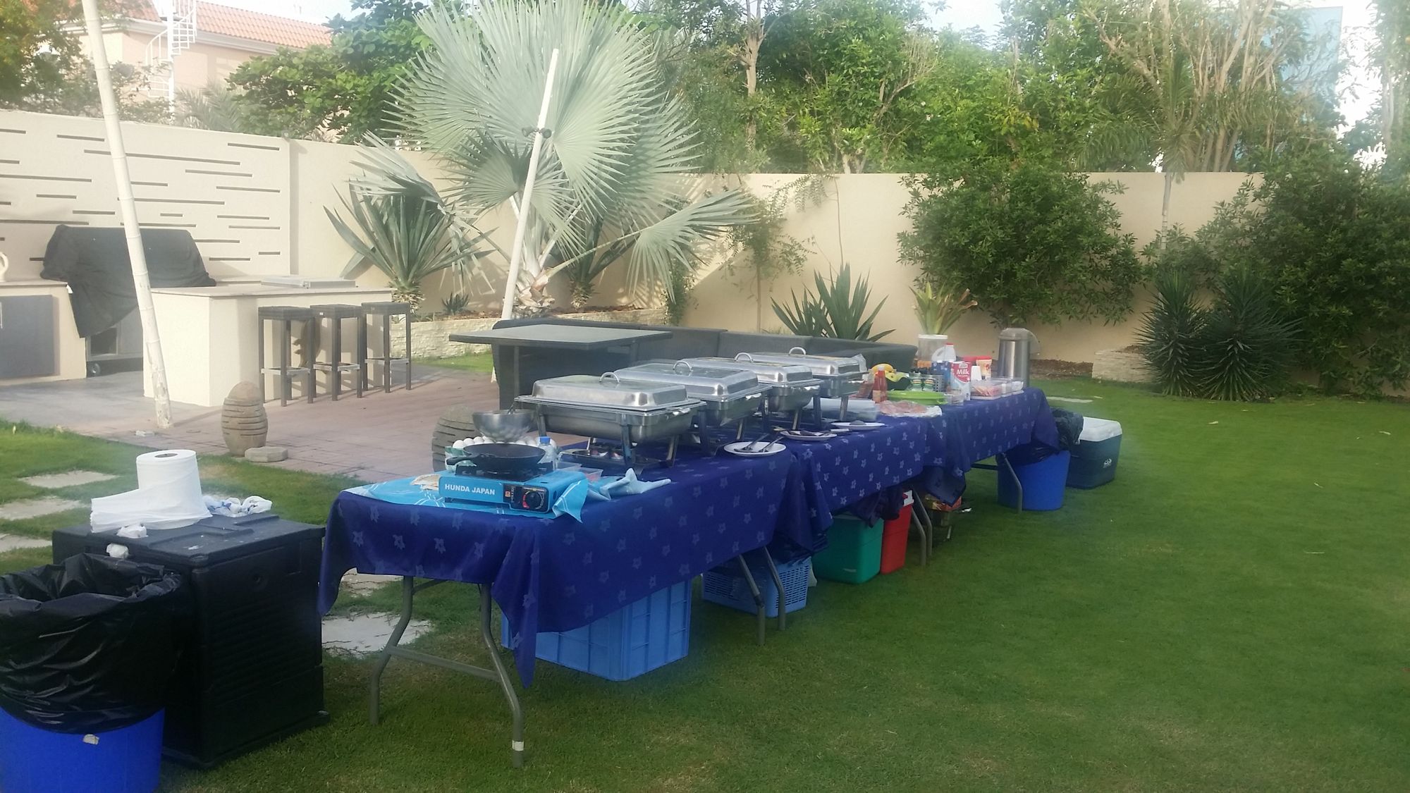 Outdoor catering line on a garden lawn.