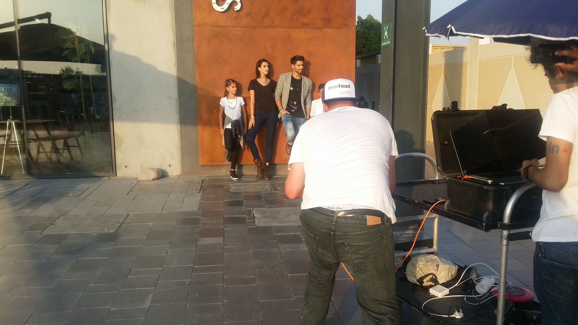 Crew and talent on an outdoor commercial set.